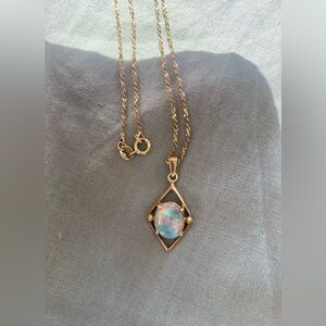 10k gold 22” chain necklace with diamond shaped pendant with opal gem